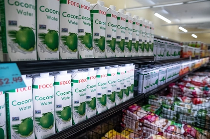 Image Tetra Pak cartons on supermarket shelf.