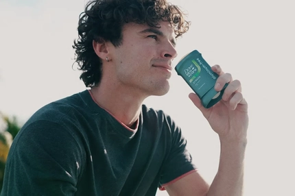 A man smelling a Dove deodorant.