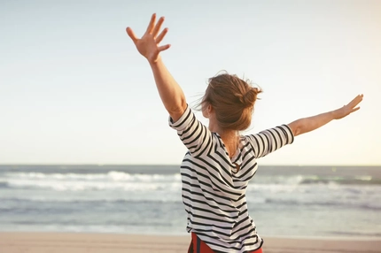 Image Happy woman on the beach