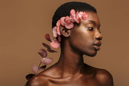 Image A woman with flowers going up her head.