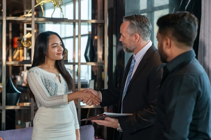 Image man in suit shakes hands with women, business deal