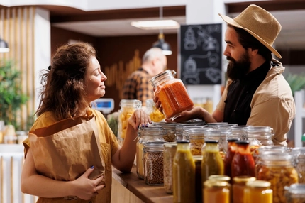 Woman shops for beans and pulses.