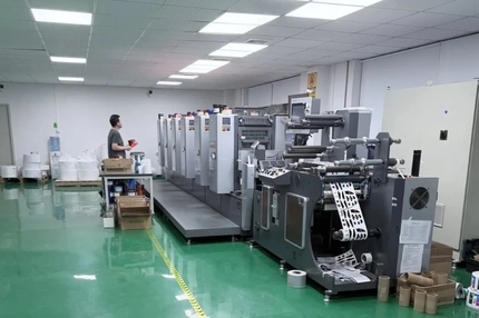 Image A flexographic press producing printed packaging labels at SZKAYU Packaging's manufacturing facility in China.