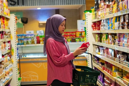 A woman shops at a supermarket in Indonesia.