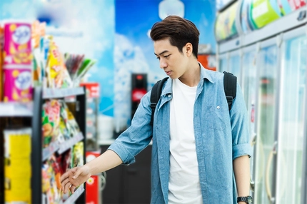 Image Asian man shopping at a convenience store.