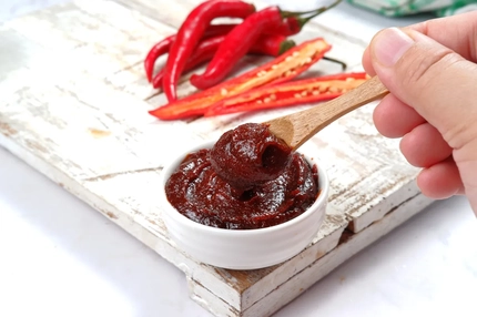 Image Gochujang sauce on spoon.