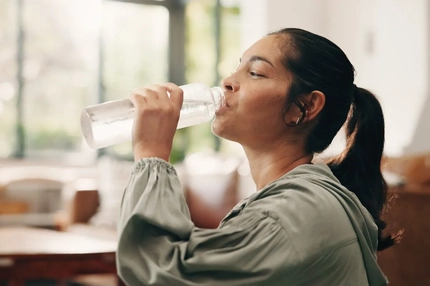 Image people drinking from a bottle