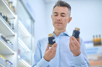 Image Man selecting omega supplement