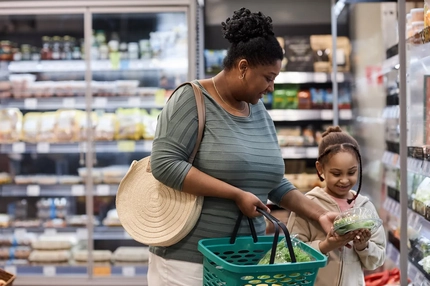 Woman and child shopping in supermarket
