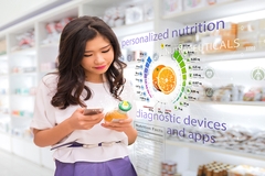 Woman scanning a juice bottle with smartphone showing personalized nutrition data