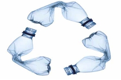 Image Crunched plastic bottles in recycle symbol