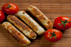Image Grilled sausages with fresh tomatoes.