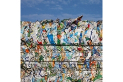 Bales of compressed used beverage cartons prepared for recycling