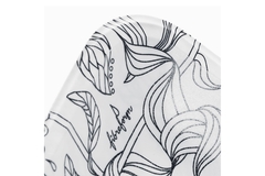 Image black and white floral patterned ceramic plate with modern minimalist design on white background