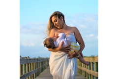 Woman Wearing White Dress carrying baby