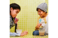 Image Kids drinking juice with straws