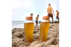 Two bottles in the sand