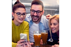 People looking at a phone's screen