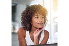 Image natural beauty portrait of young woman with curly hair and glowing skin indoors
