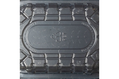 PET plastic tray with recycling symbols and embossed labeling indicating it is made from 100% recycled material