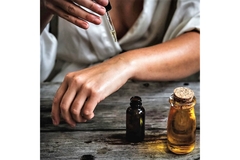 Image A person testing essential oil on their hand