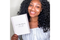 Image A lady holding Myavana hair kit box