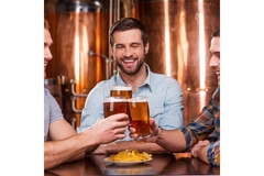 Image Three men drinking beer in a bar.
