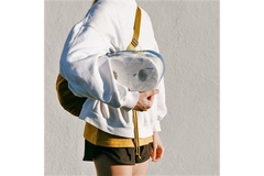 Woman carrying toilet paper.