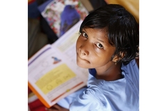 Girl looking up from her textbook
