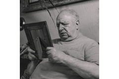 Old person looking at picture.