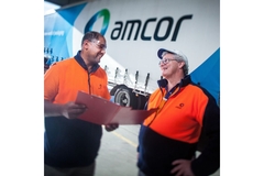 Image amcor workers infront of an Amcor labelled truck