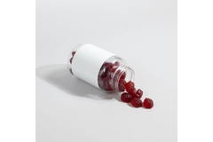 Bottle with fruit gummies.