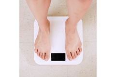 Feet on a weight scale.