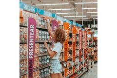Woman shopping for a box of chocolates.