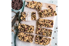 Image A tray of granola bars made with nuts and seeds.
