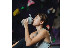 Image Woman drinking sports drink.