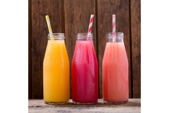 Image Glasses with different colored drinks in them.