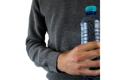 Image Man holding water bottle.