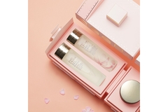 Image Two bottles of Estée Lauder Micro Essence product inside a box.