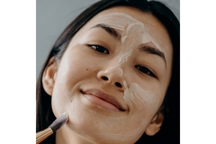 Image woman applying cream with brush