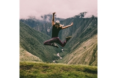 Person jumping in the mountains.