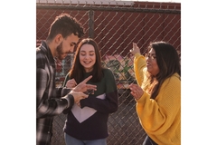 Teens talking at a school.
