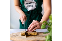 Image Woman cutting mycoprotein on cuttingboard