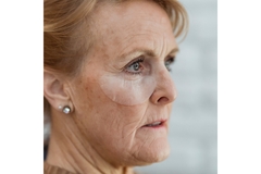 Image close up of an old woman with wrinkles and other signs of aging
