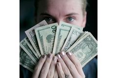 Image Woman holding money in her hands