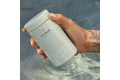 Image Product image of hand holding tin of supplements by a brand called Hair Blends.