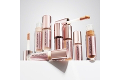 Image A collection of metallic-capped cosmetics by the brand Revolution Beauty.