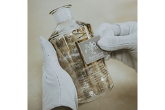 Image adding label to a perfume bottle