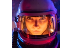 Image A female astronaut wearing a space suit.