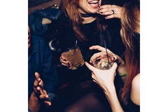 Image Women drinking cocktails in a club
